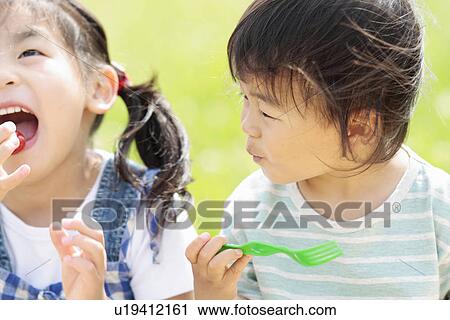 Stock Image - Close-Up of Children Having Lunch. Fotosearch