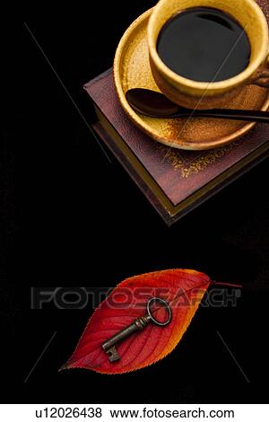 Stock Photo - Coffee, Book and a Key. Fotosearch