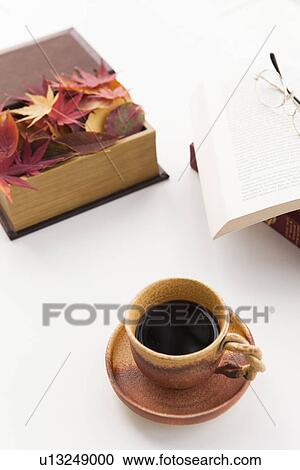 Stock Image - Coffee, Books and Autumnal Leaves. Fotosearch