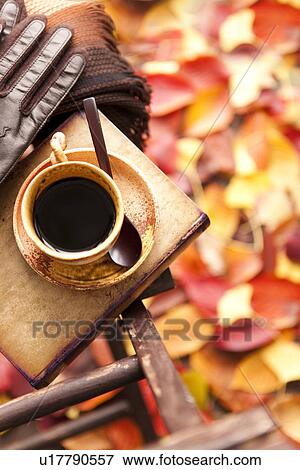 Stock Photo - Coffee Cup and Autumnal Leaves. Fotosearch