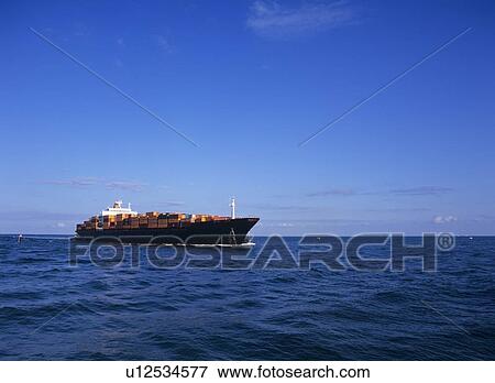 Container ship on sea, Florida, USA View Large Photo Image Stock Photo - Container ship on sea, Florida, USA. Fotosearch