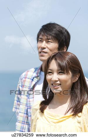Stock Photo - Couple Against Blue Sky. Fotosearch