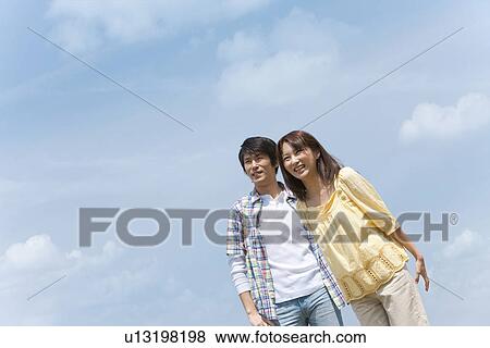 Couple Against Sky View Large Photo Image Stock Photo - Couple Against Sky. Fotosearch