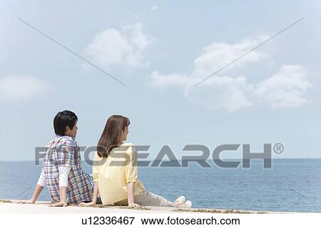 Couple Looking at Sea View Large Photo Image Stock Photo - Couple Looking at Sea. Fotosearch