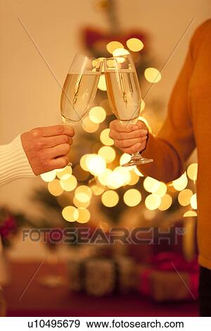 Stock Photo - Couple Toasting With Champagne. Fotosearch