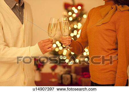 Stock Photo - Couple Toasting With Champagne. Fotosearch