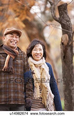 Couple Walking In the Woods In Autumn View Large Photo Image Picture - Couple Walking In the Woods In Autumn. Fotosearch