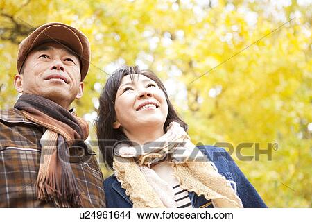 Couple Walking In the Woods In Autumn View Large Photo Image Picture - Couple Walking In the Woods In Autumn. Fotosearch