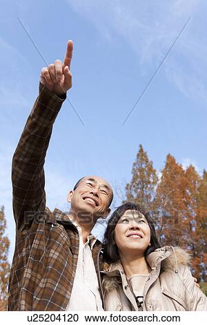 Couple Walking In the Woods In Autumn View Large Photo Image Stock Image - Couple Walking In the Woods In Autumn. Fotosearch