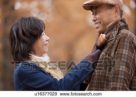 Couple Walking In the Woods In Autumn View Large Photo Image Stock Photo - Couple Walking In the Woods In Autumn. Fotosearch