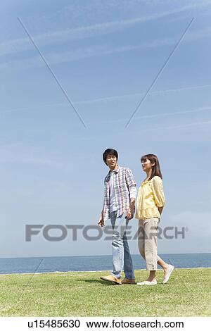 Couple Walking on Beach View Large Photo Image Stock Image - Couple Walking on Beach. Fotosearch