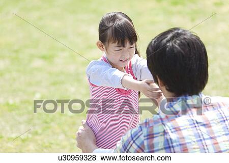 Stock Photo - Daughter Reaching For Father. Fotosearch