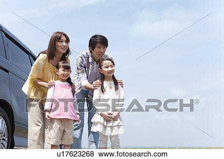 Family of Four By Car View Large Photo Image Stock Photo - Family of Four By Car. Fotosearch