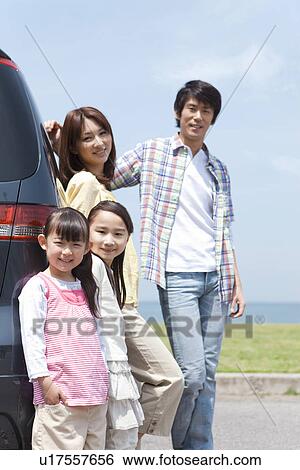 Family of Four By Car View Large Photo Image Stock Photograph - Family of Four By Car. Fotosearch