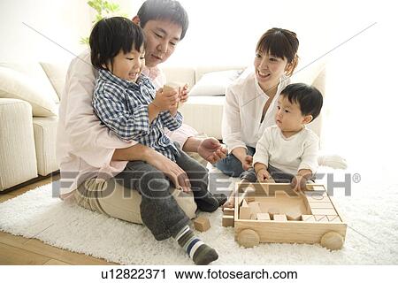 Family of four playing on floor View Large Photo Image Stock Image - Family of four playing on floor. Fotosearch