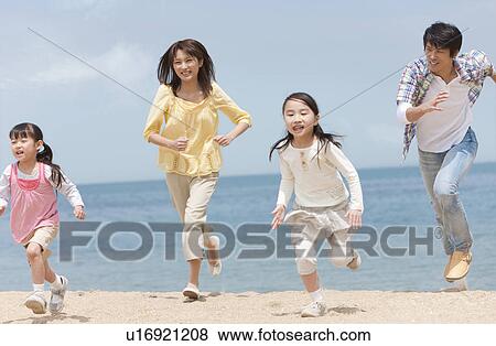 Family of Four Running on Beach View Large Photo Image Stock Photo - Family of Four Running on Beach. Fotosearch