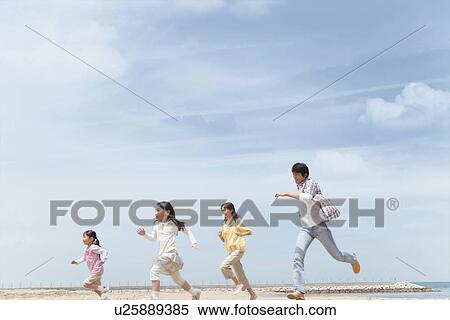 Family of Four Running on Beach View Large Photo Image Stock Photography - Family of Four Running on Beach. Fotosearch