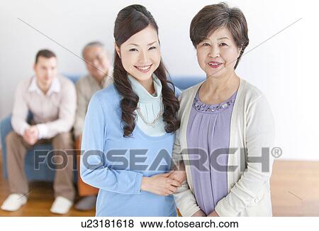 Stock Photo - Family Portrait In Living Room. Fotosearch