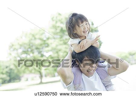 Father carrying daughter on the shoulders View Large Photo Image Stock Image - Father carrying daughter on the shoulders. Fotosearch