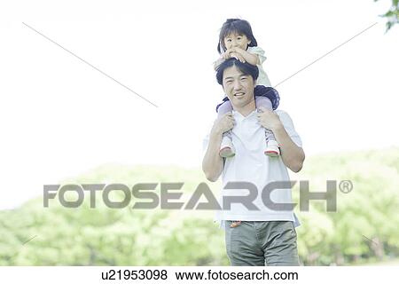 Father carrying daughter on the shoulders View Large Photo Image Stock Photo - Father carrying daughter on the shoulders. Fotosearch