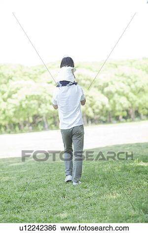Father carrying daughter on the shoulders View Large Photo Image Stock Photograph - Father carrying daughter on the shoulders. Fotosearch