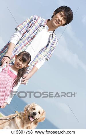 Stock Photo - Father, Daughter and Dog. Fotosearch