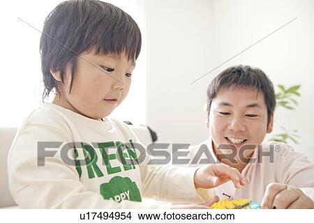 Picture - Father playing with son. Fotosearch
