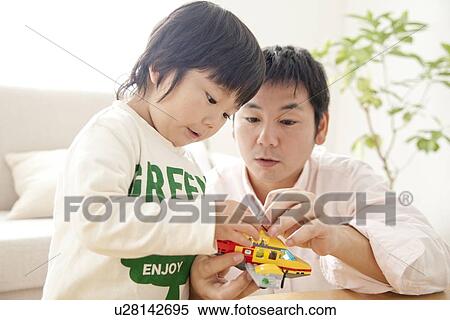 Father playing with son View Large Photo Image Stock Photography - Father playing with son. Fotosearch