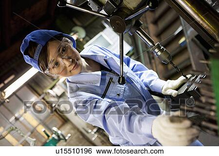 Female Factory Worker Operating Machine View Large Photo Image Stock Photograph - Female Factory Worker Operating Machine. Fotosearch