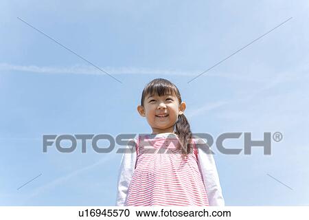 Girl Against Blue Sky View Large Photo Image Stock Image - Girl Against Blue Sky. Fotosearch