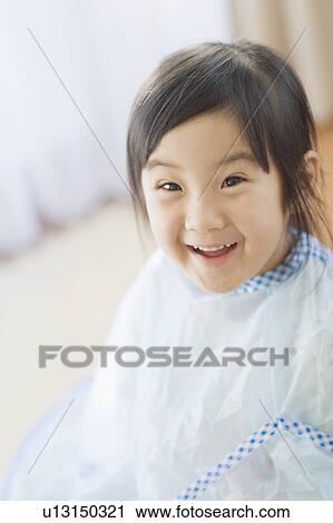 Girl getting a haircut View Large Photo Image Stock Image - Girl getting a haircut. Fotosearch