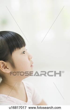 Stock Photo - Girl looking away. Fotosearch