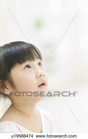 Picture - Girl looking up. Fotosearch