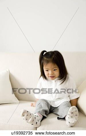 Girl on sofa View Large Photo Image Stock Photography - Girl on sofa. Fotosearch