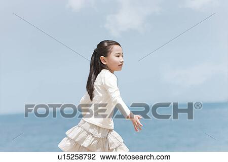 Girl Running on Beach View Large Photo Image Stock Image - Girl Running on Beach. Fotosearch