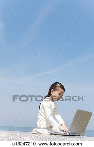 Girl Using Laptop on Beach View Large Photo Image Stock Image - Girl Using Laptop on Beach. Fotosearch