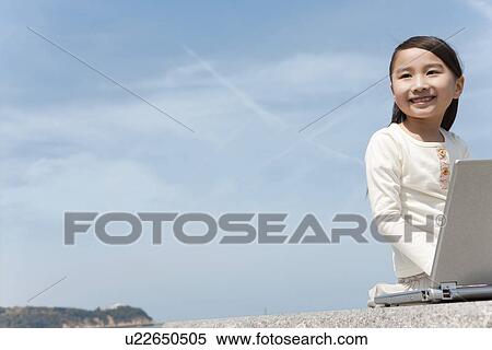 Girl Using Laptop on Beach View Large Photo Image Stock Photography - Girl Using Laptop on Beach. Fotosearch