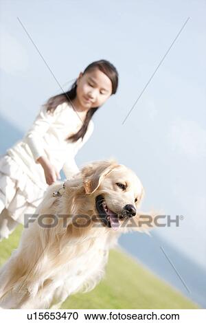 Stock Image - Girl With Dog. Fotosearch