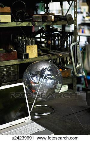 Globe and Laptop In Factory View Large Photo Image Stock Image - Globe and Laptop In Factory. Fotosearch