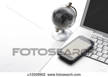 Globe and Smart Phone on Desk View Large Photo Image Stock Image - Globe and Smart Phone on Desk. Fotosearch