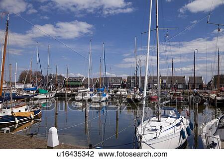 Stock Image - Harbor and Houses in Marken. Fotosearch