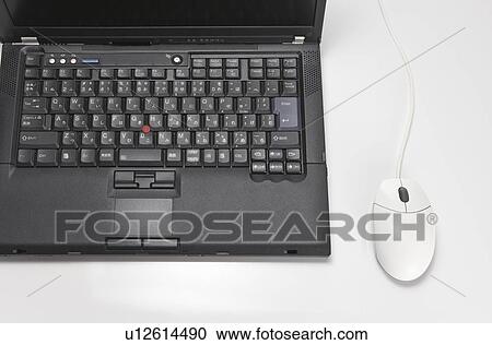 Stock Image - Laptop and computer mouse. Fotosearch