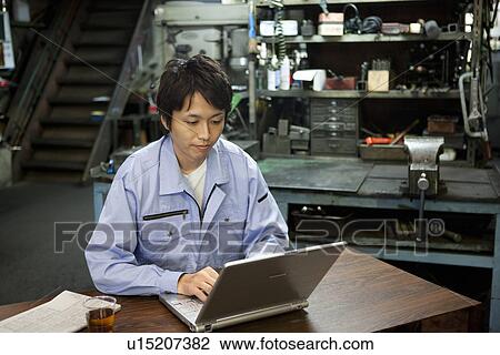Male Factory Worker Using Laptop View Large Photo Image Stock Image - Male Factory Worker Using Laptop. Fotosearch