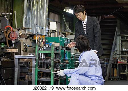 Stock Photo - Male Worker Talking to Boss. Fotosearch