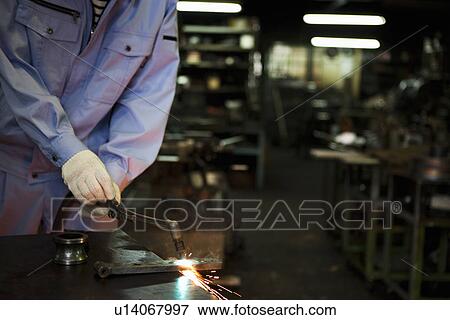 Stock Photo - Male Worker Welding. Fotosearch