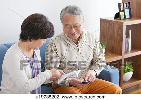 Mature Couple In Living Room View Large Photo Image Stock Image - Mature Couple In Living Room. Fotosearch