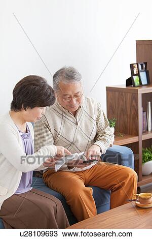Mature Couple In Living Room View Large Photo Image Stock Image - Mature Couple In Living Room. Fotosearch