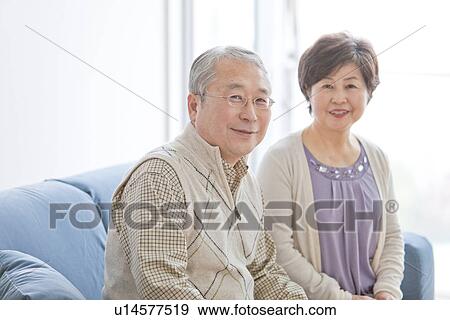 Stock Photo - Mature Couple In Living Room. Fotosearch