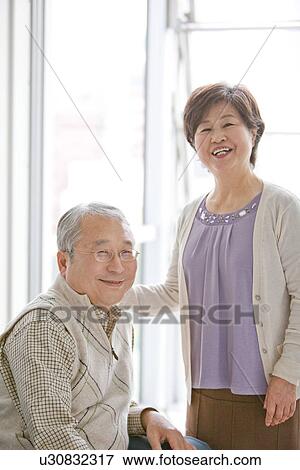 Mature Couple In Living Room View Large Photo Image Stock Photo - Mature Couple In Living Room. Fotosearch