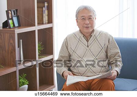 Stock Photo - Mature Man In Living Room. Fotosearch